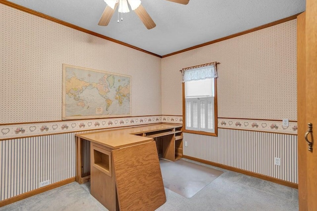 carpeted home office with a textured ceiling, ceiling fan, and ornamental molding