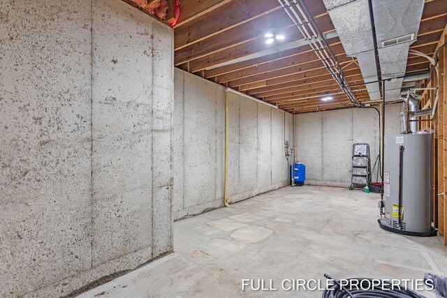 basement featuring gas water heater