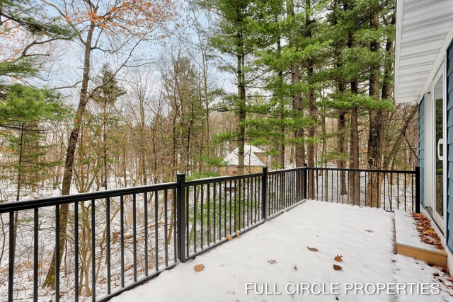 view of snow covered deck