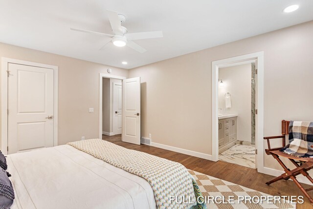 bedroom featuring connected bathroom, ceiling fan, and dark hardwood / wood-style floors