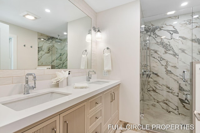 bathroom featuring vanity, tasteful backsplash, and walk in shower