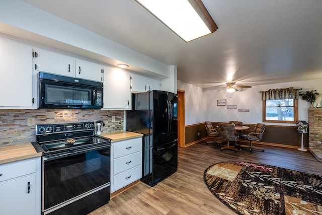 kitchen with ceiling fan, backsplash, light hardwood / wood-style floors, white cabinets, and black appliances