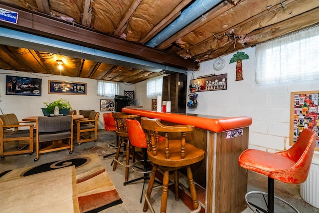 bar featuring concrete floors