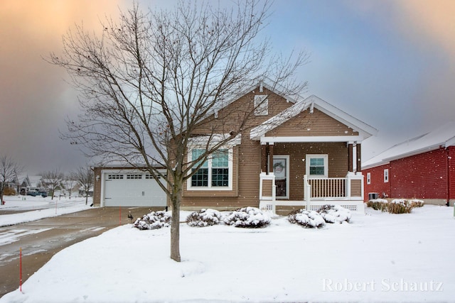 view of front of house with a porch and a garage