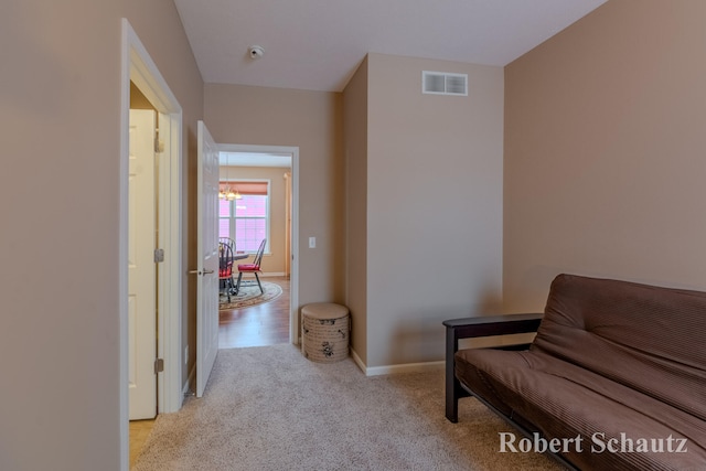 living area featuring light colored carpet