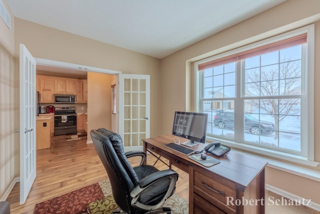 office featuring french doors and light wood-type flooring