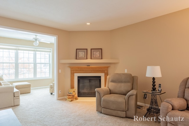 living room featuring ceiling fan and carpet floors