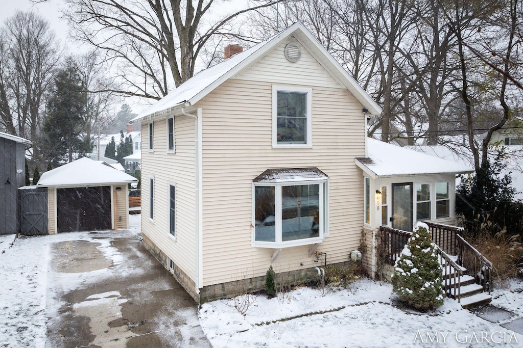 front of property featuring an outdoor structure and a garage