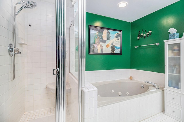 bathroom featuring tile patterned flooring and shower with separate bathtub