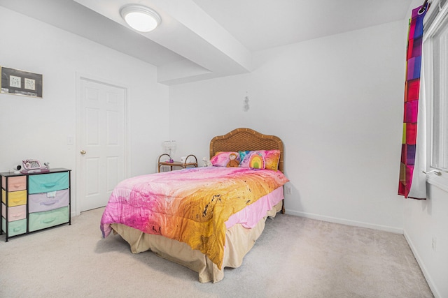 bedroom featuring light carpet