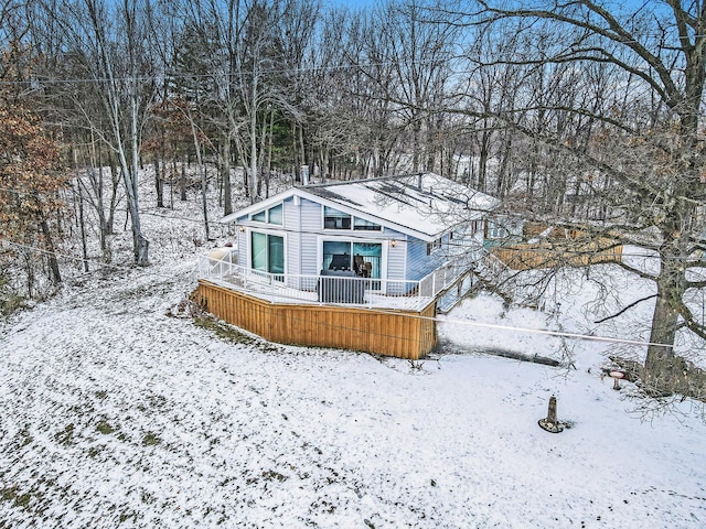 view of snow covered house