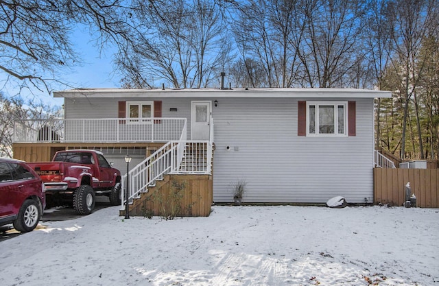 view of front of house featuring a porch and a garage