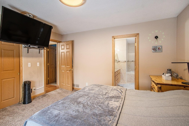 bedroom featuring carpet flooring and ensuite bathroom