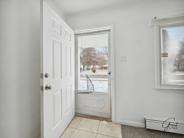 doorway to outside featuring light tile patterned floors and baseboard heating