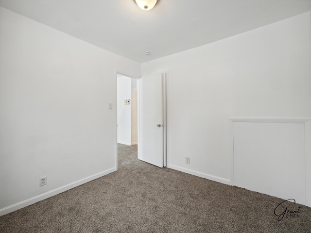 empty room with carpet flooring