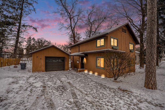 view of front of house featuring an outdoor structure and a garage