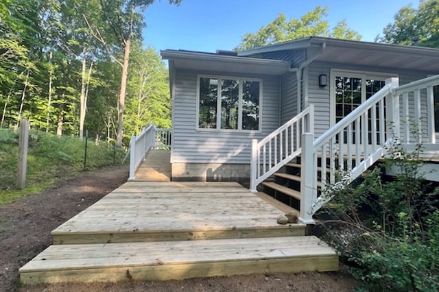 exterior space featuring a wooden deck