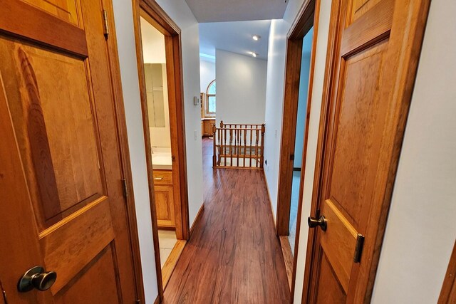 corridor featuring hardwood / wood-style flooring