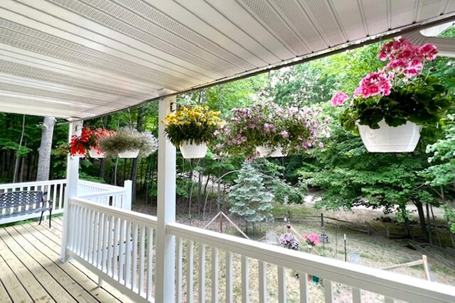 wooden terrace featuring a porch