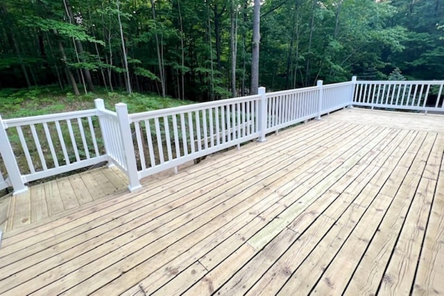 deck featuring a view of trees