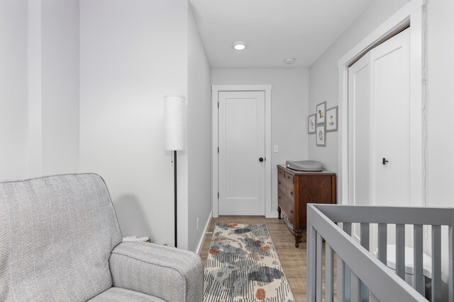 bedroom featuring a closet and light hardwood / wood-style floors