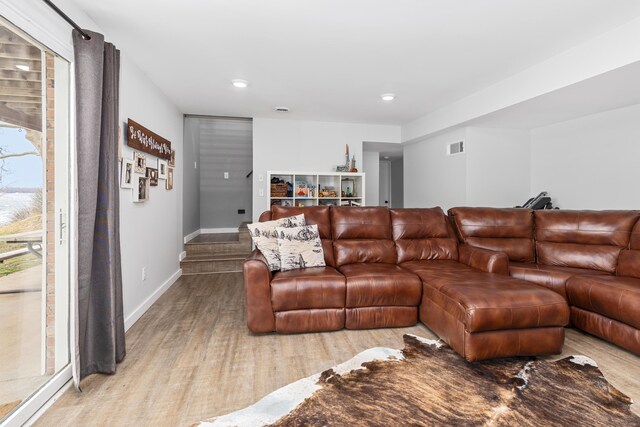 living room with light hardwood / wood-style floors