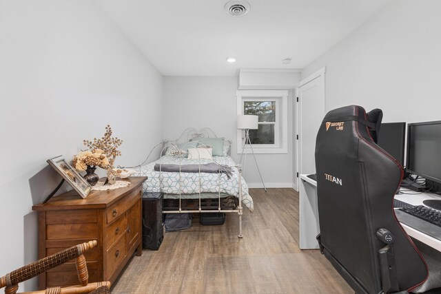 bedroom featuring wood-type flooring