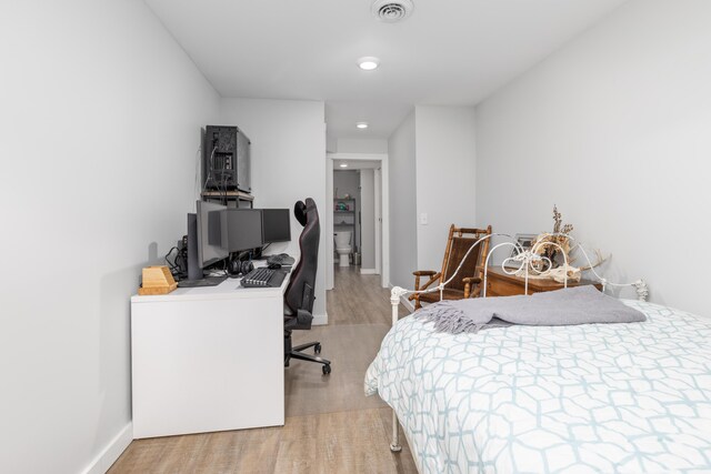 bedroom featuring wood-type flooring