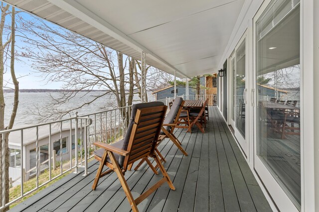 wooden terrace with a water view