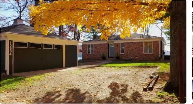 ranch-style home featuring a garage