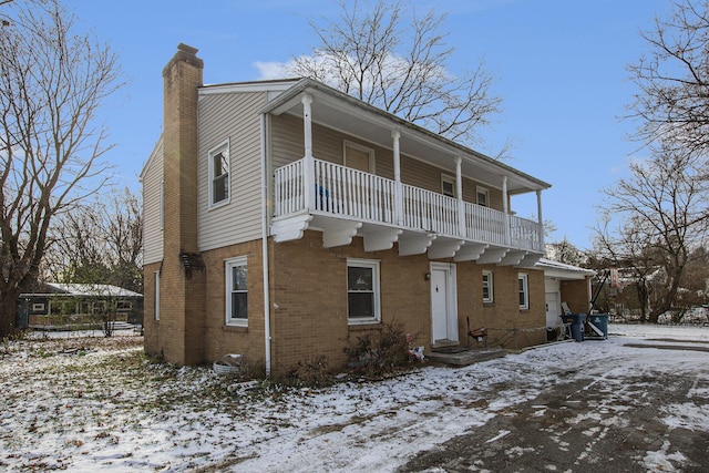 view of front of home with a balcony