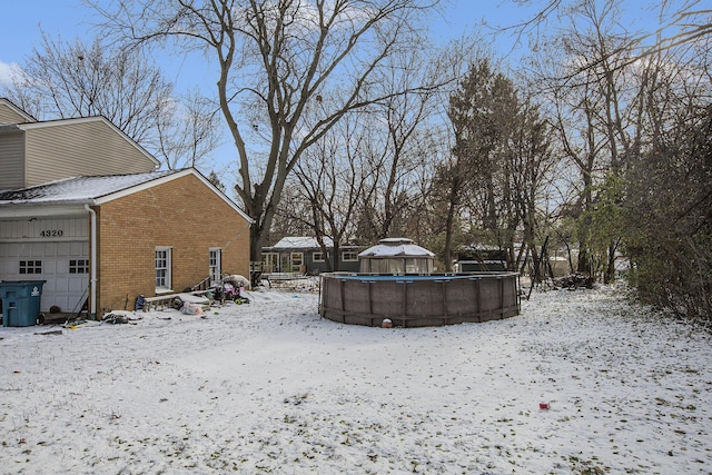 view of yard covered in snow