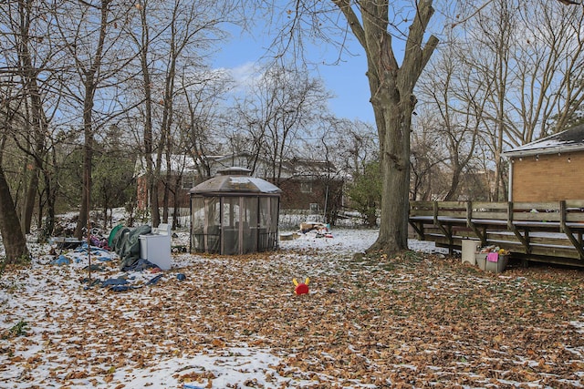 yard layered in snow featuring an outbuilding