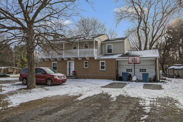 view of front facade with a balcony and a garage