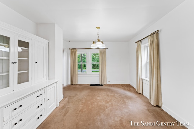 spare room with light colored carpet