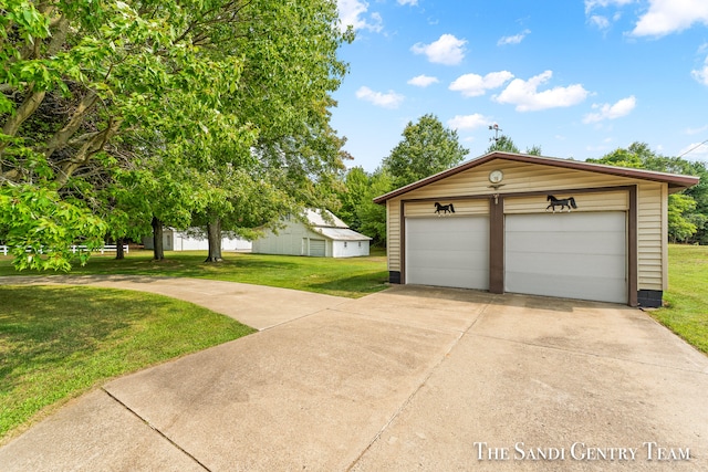 garage featuring a yard