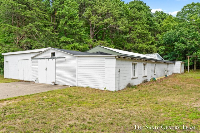 garage with a lawn