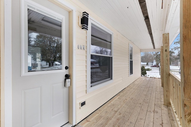 view of snow covered deck