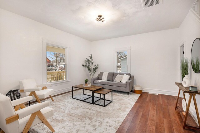 living room with light hardwood / wood-style flooring