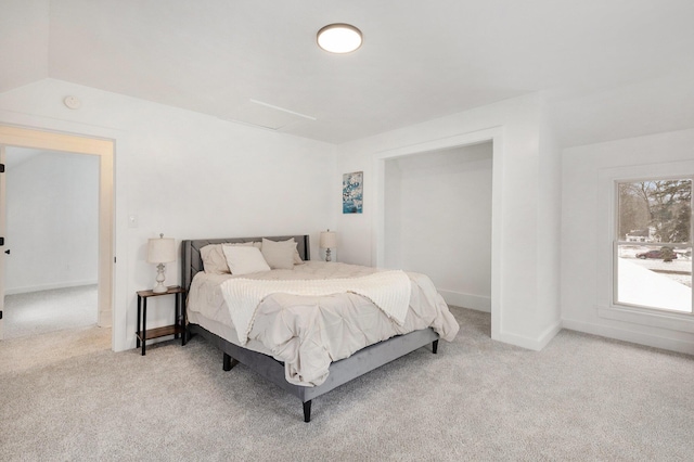 carpeted bedroom featuring vaulted ceiling