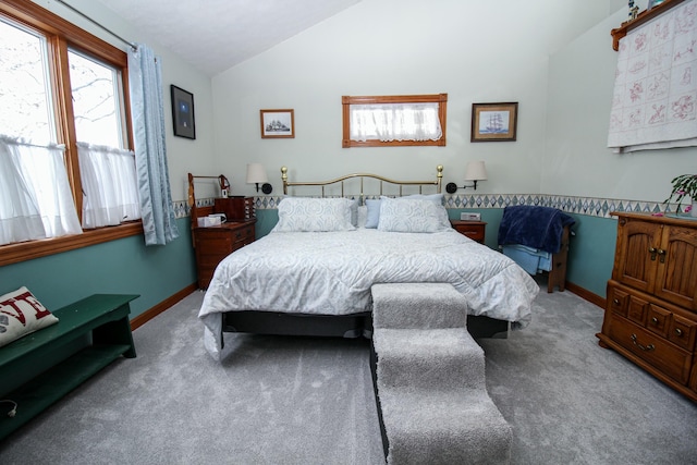 carpeted bedroom featuring vaulted ceiling