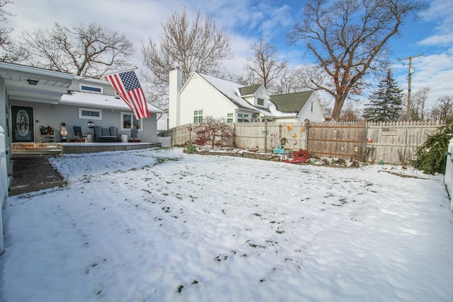 snowy yard featuring central AC unit