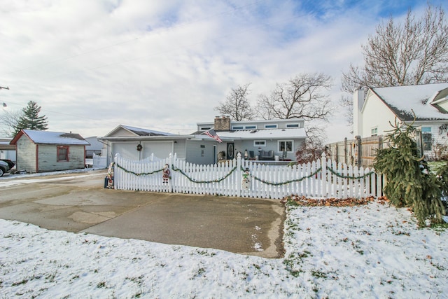 view of front of home featuring an outbuilding and a garage