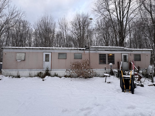 view of snow covered house