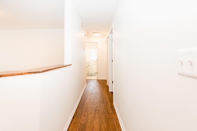 hallway featuring hardwood / wood-style flooring