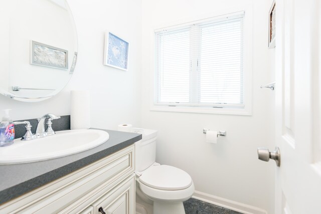 bathroom with vanity and toilet