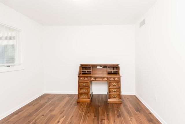 unfurnished office featuring dark hardwood / wood-style flooring