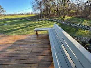 wooden deck with a yard