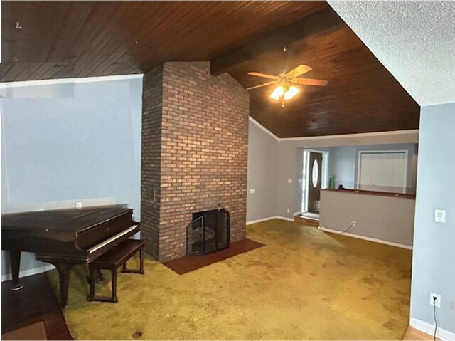 unfurnished living room featuring carpet floors, a fireplace, lofted ceiling with beams, ceiling fan, and wooden ceiling