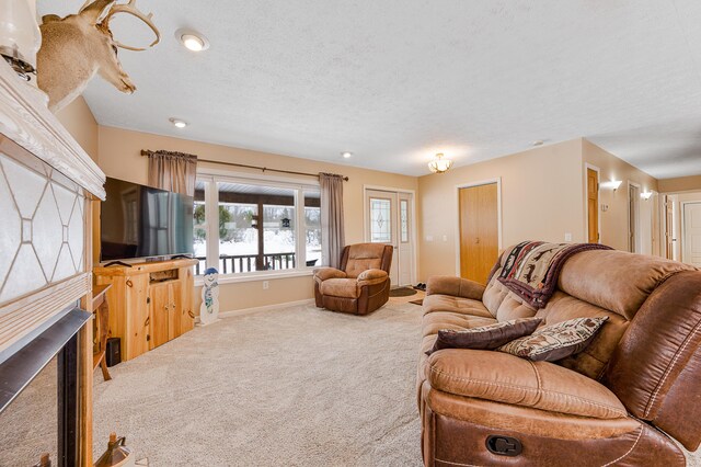 living room with carpet floors and a textured ceiling